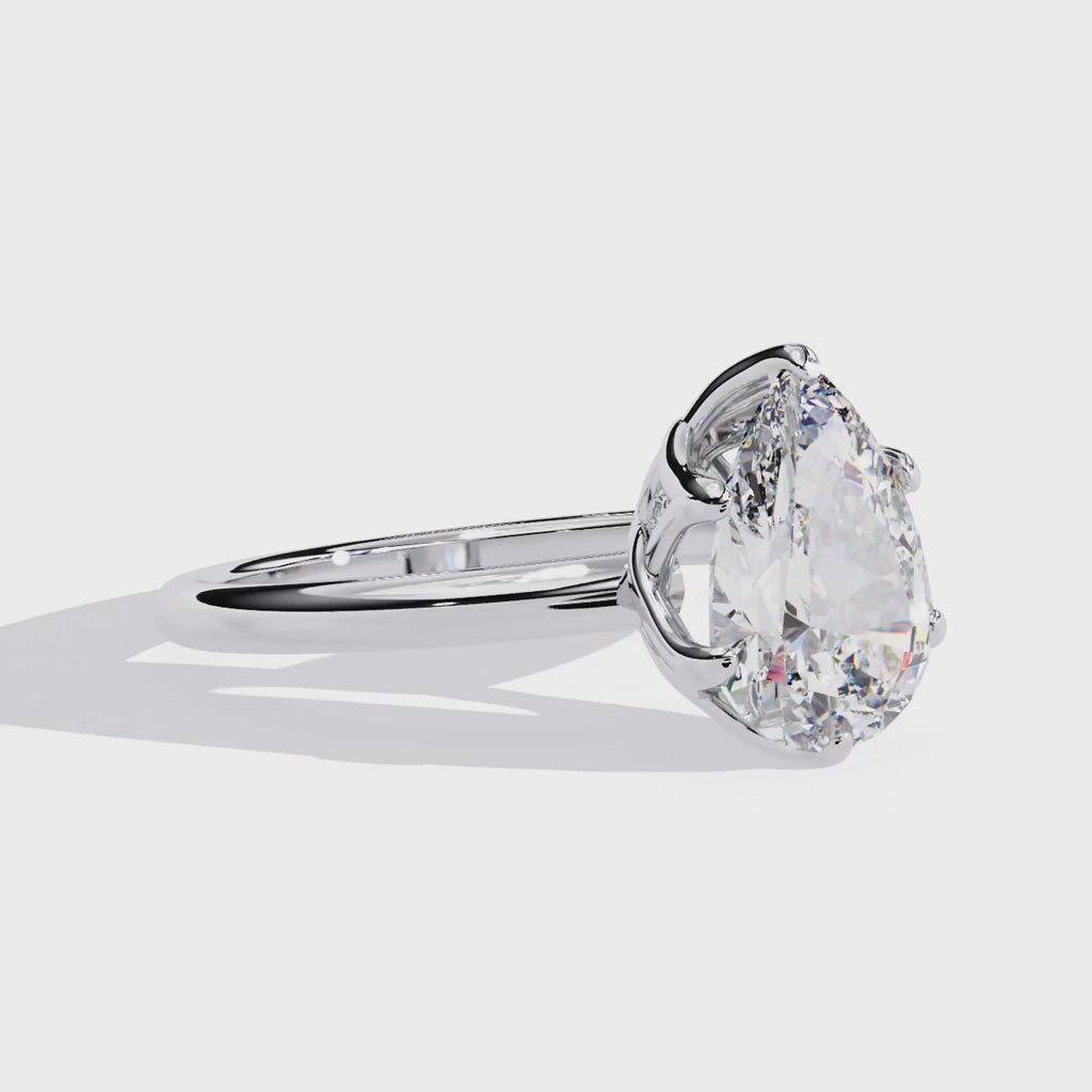 Elegant Central Stone Diamond Ring with Side Brilliance